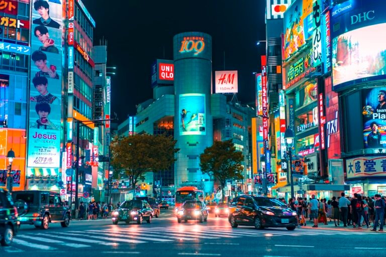 Travelers exploring Tokyo streets using their phones — stay connected in Japan with an eSIM - Japan eSIM 2026