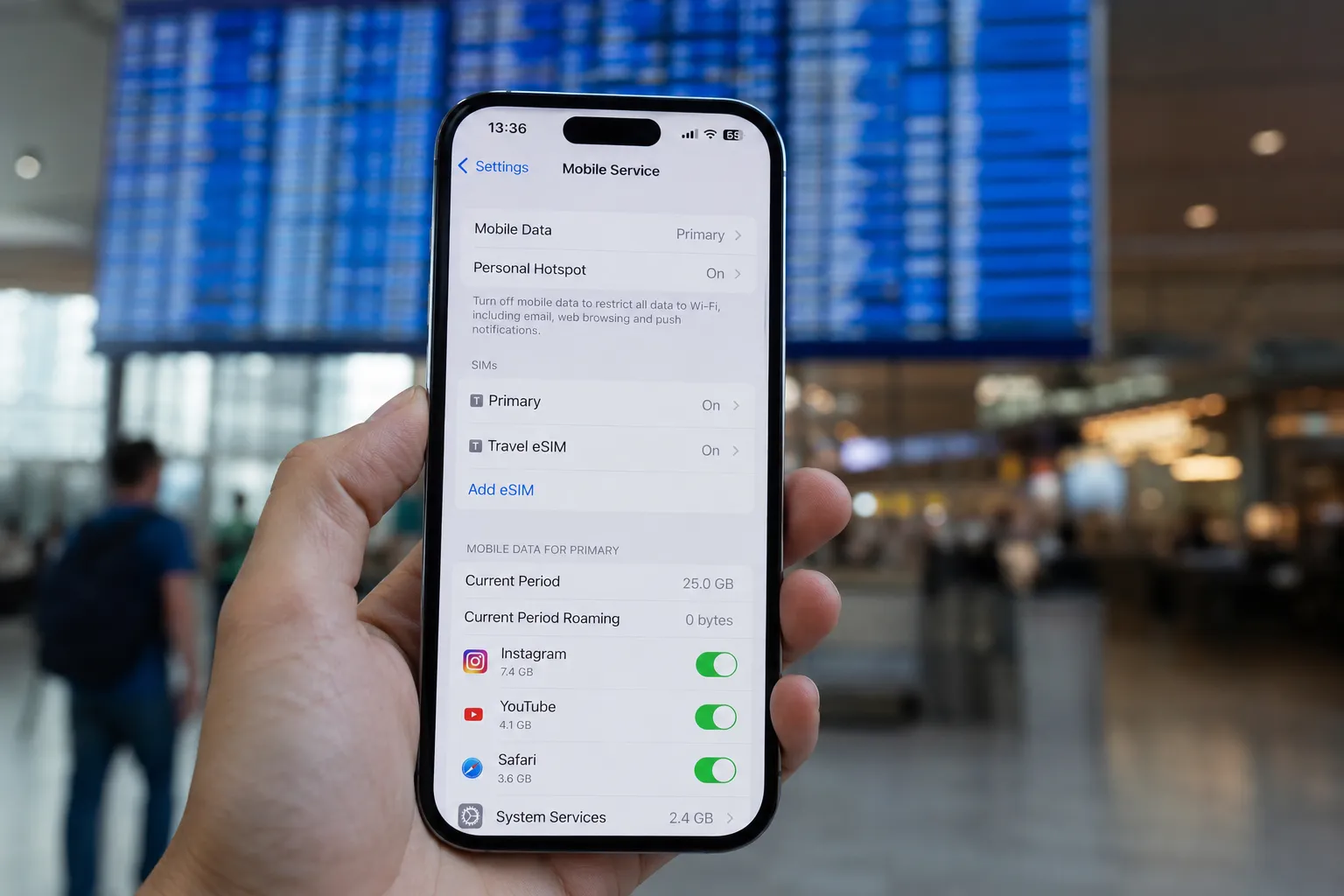Traveler at international airport checking phone — best eSIM for international travel 2026