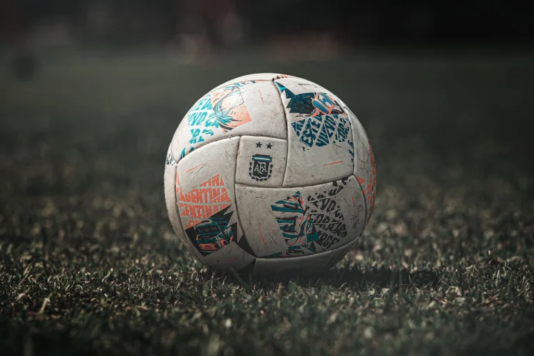 An official football on the grass pitch preparing fans using a FIFA World Cup 2026 travel guide to explore host cities with the best eSIM for FIFA World Cup 2026 connectivity across the USA, Canada, and Mexico