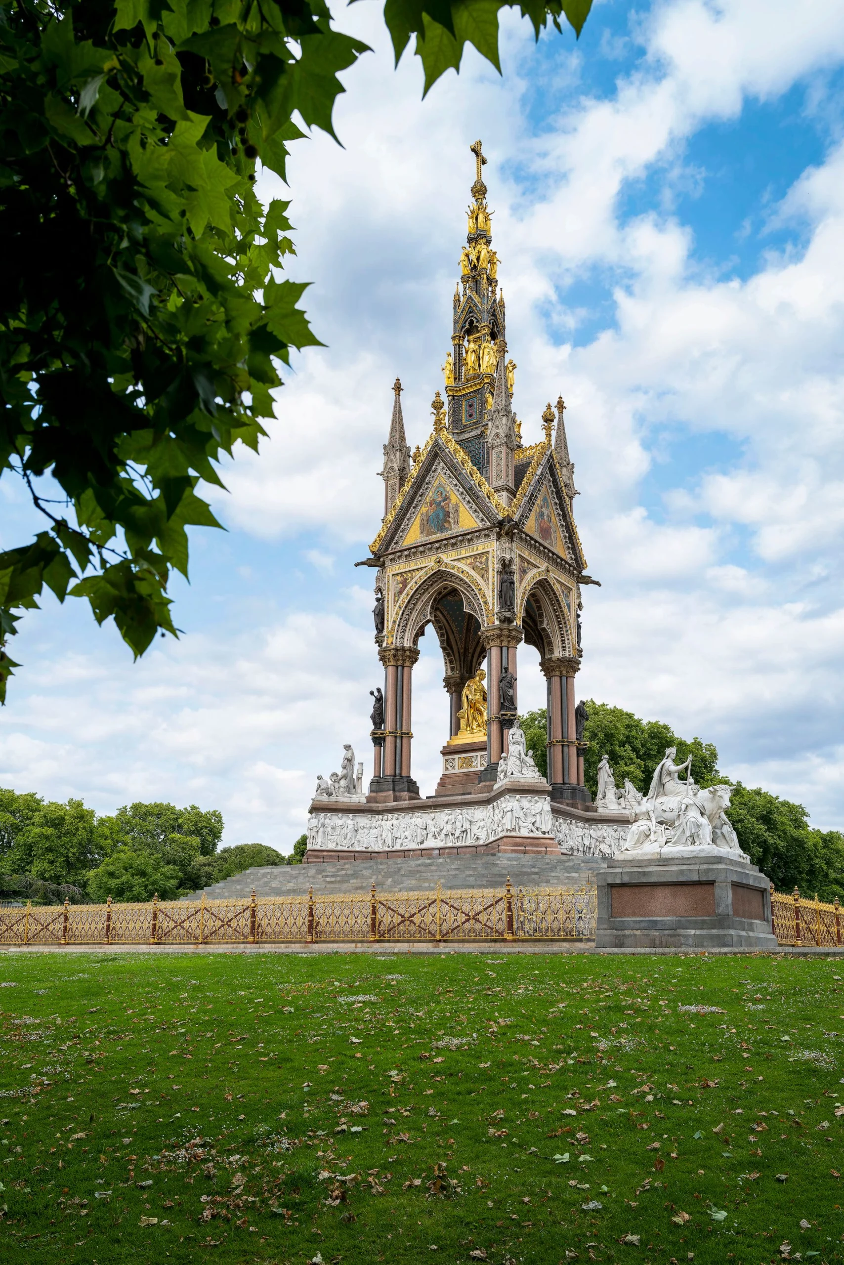 A scenic green landscape view of Hyde Park in London featuring lush trees and walking paths for travelers searching for cheap hotels in London near Hyde Park