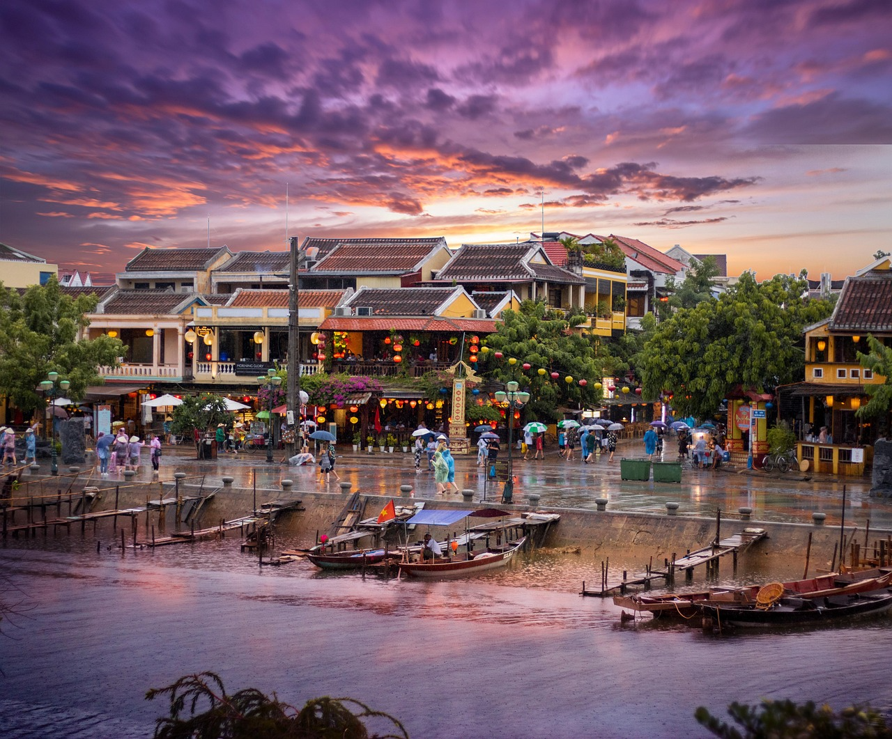 Vibrant boats docked along Hội An's scenic waterfront, Vietnam's cultural gem, illustrating a typical Vietnam travel budget in 2026